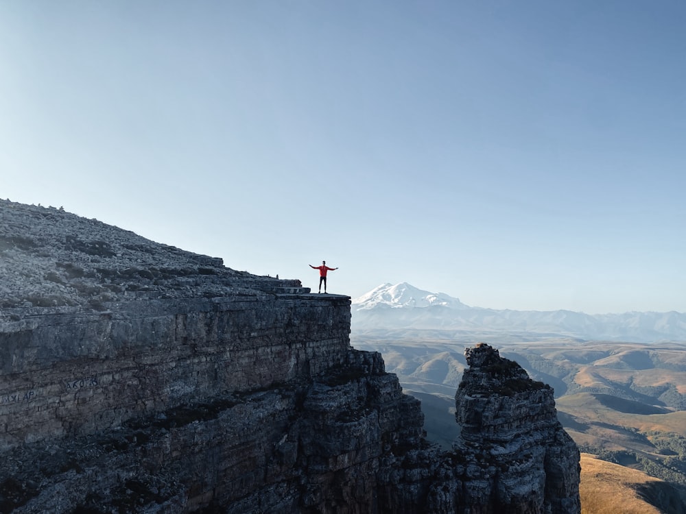 a person standing on a rock