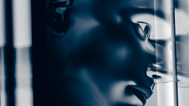 Close-up of a futuristic AI skin scanner interface glowing in pink mirror tones.