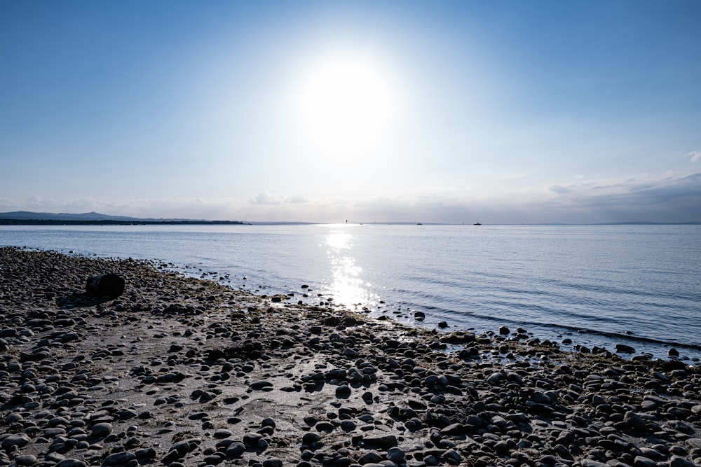 a beach with rocks and water