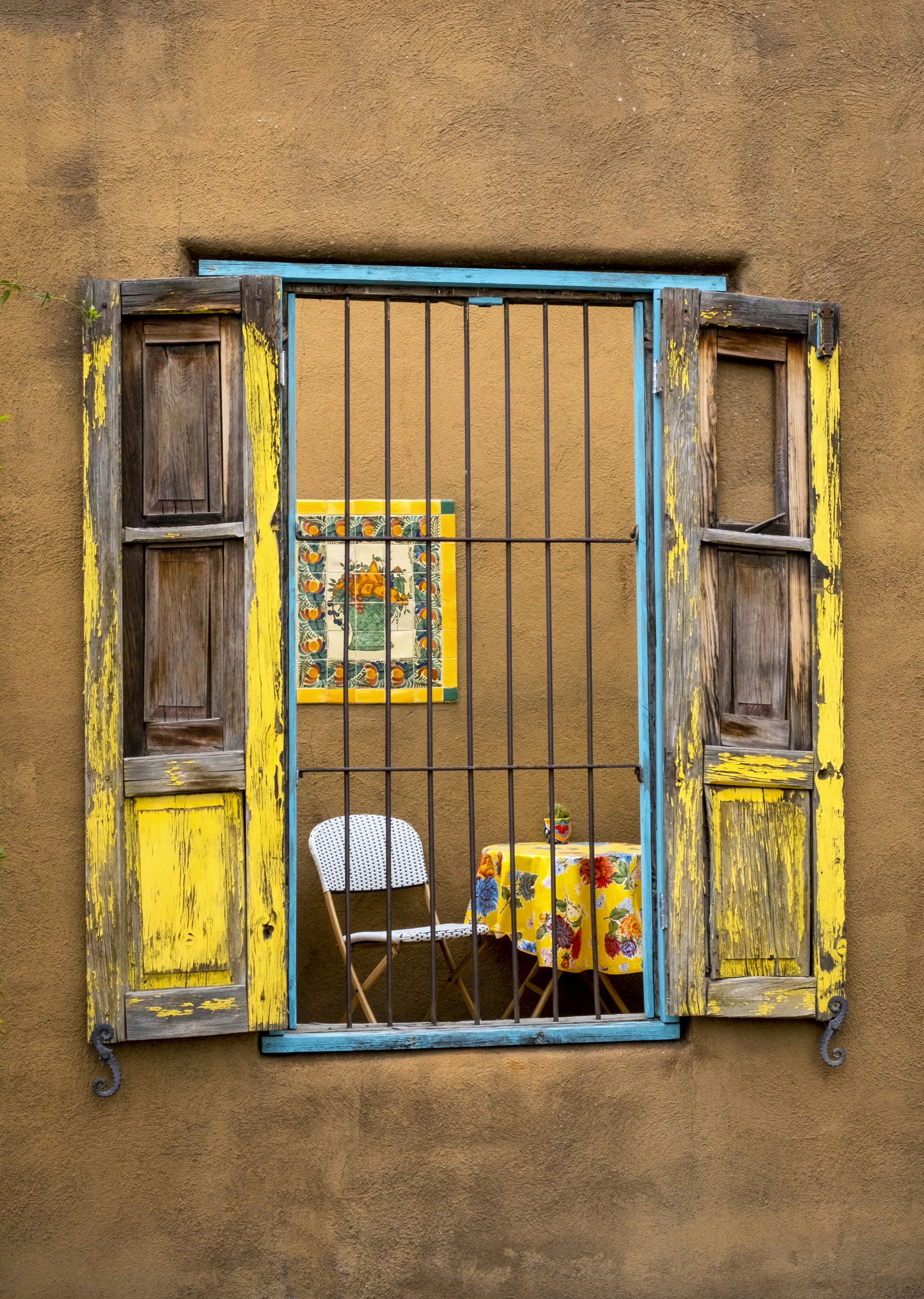 a couple of chairs in a window