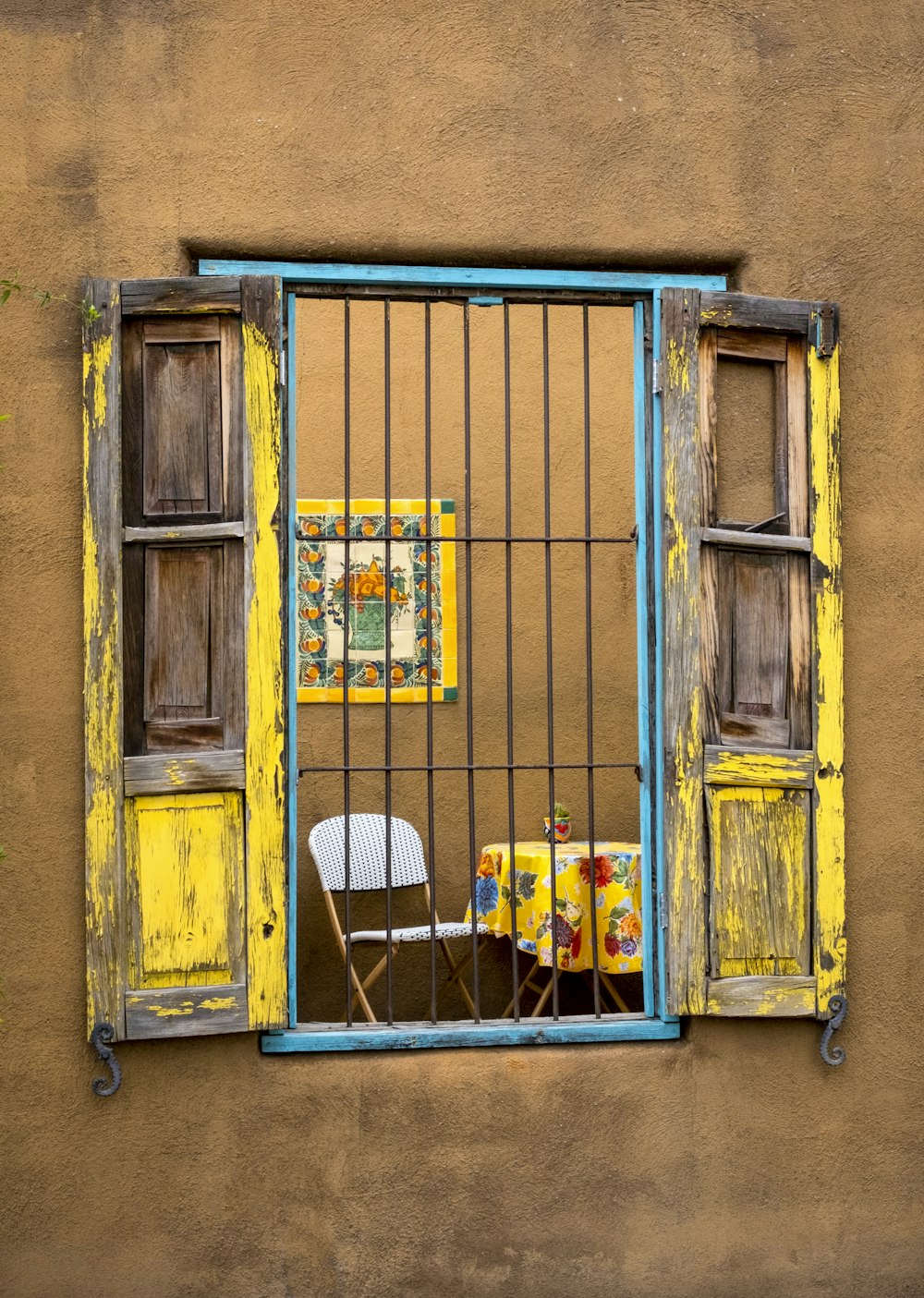 a couple of chairs in a window