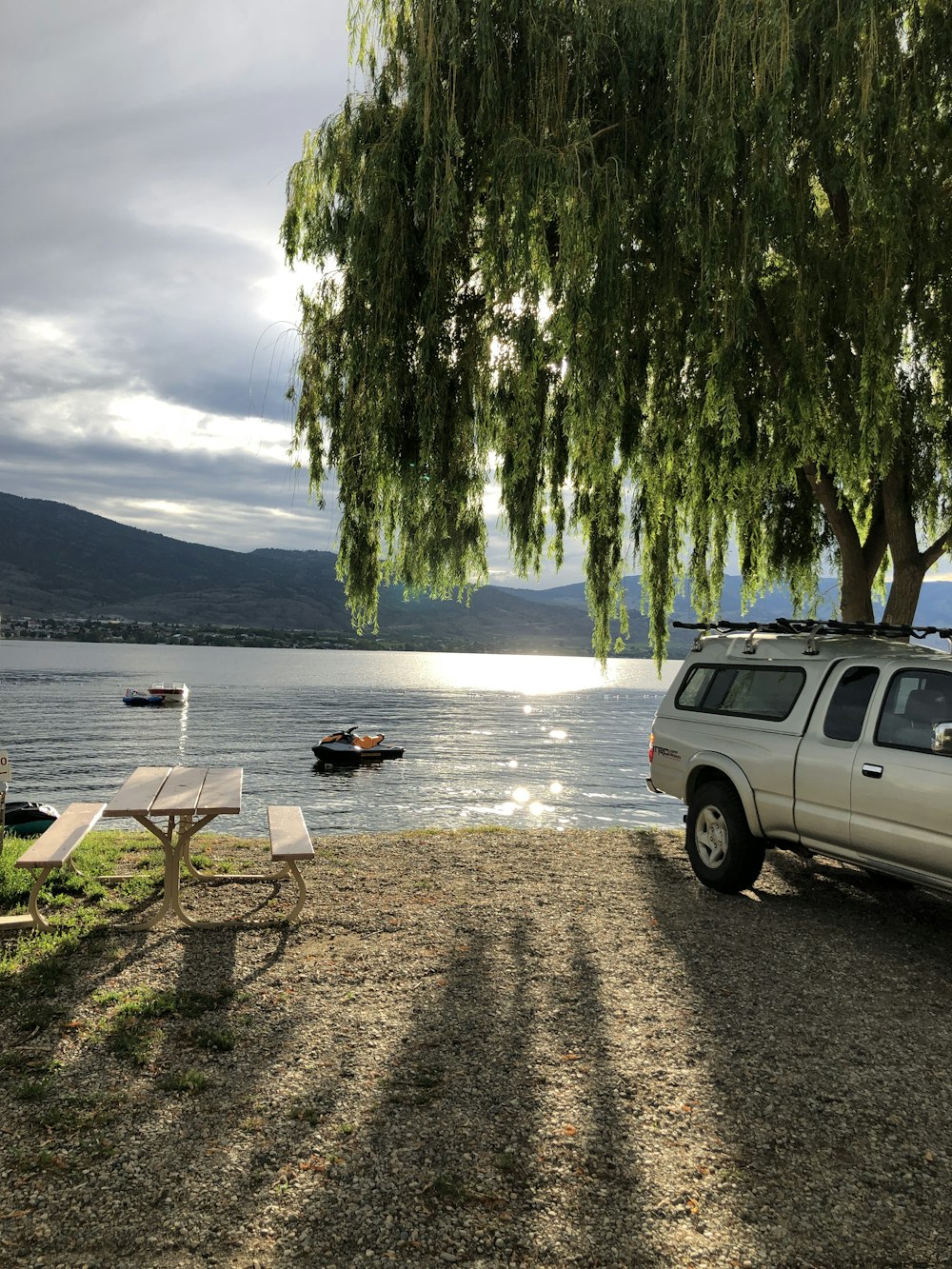 a car parked next to a lake