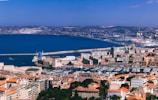 A panoramic view of Ceuta’s coastline dotted with boats and blue water.