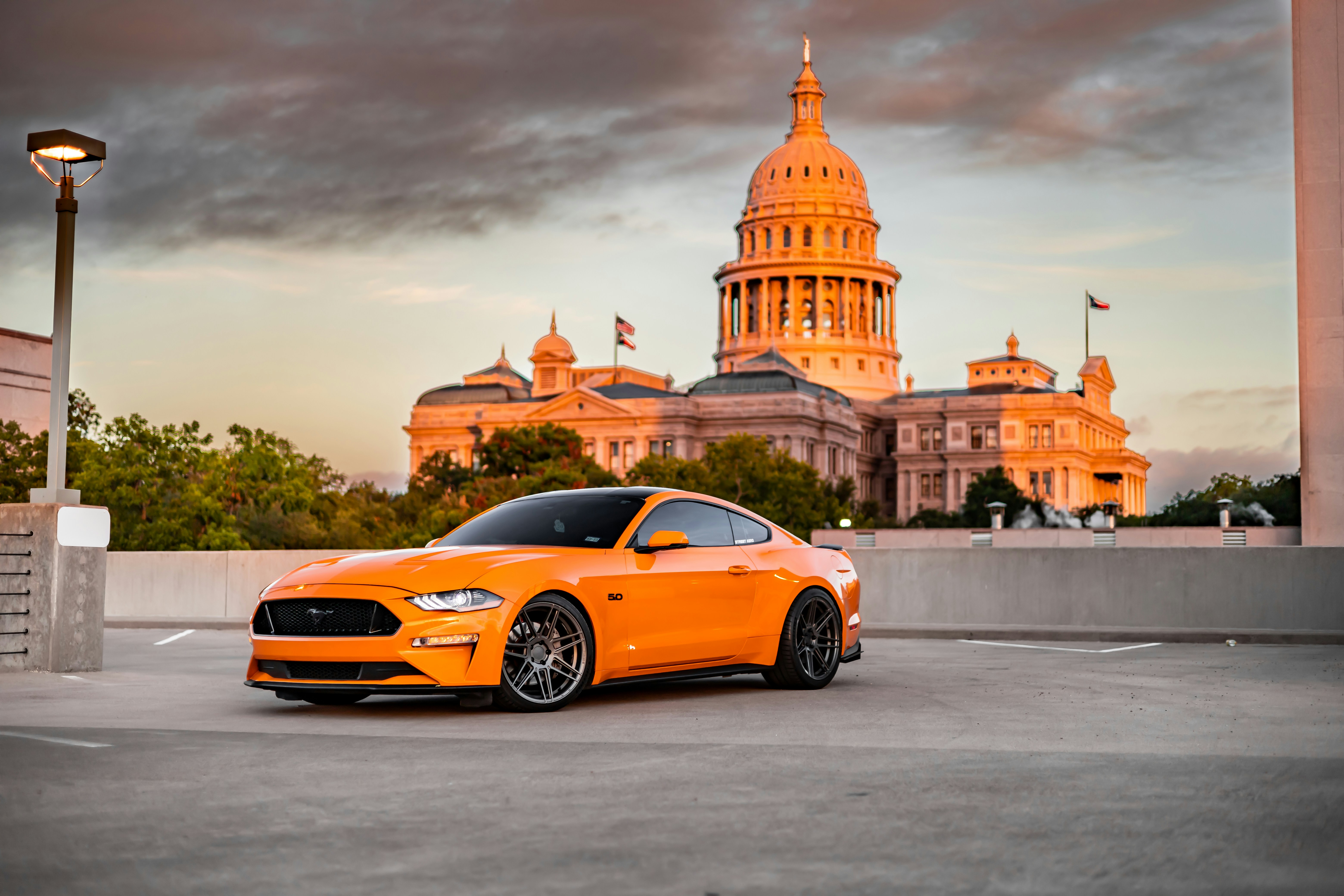 A car parked in front of a building photo – Free Automobile Image on ...