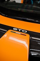 A happy customer receiving a package of auto parts at their doorstep in Italy