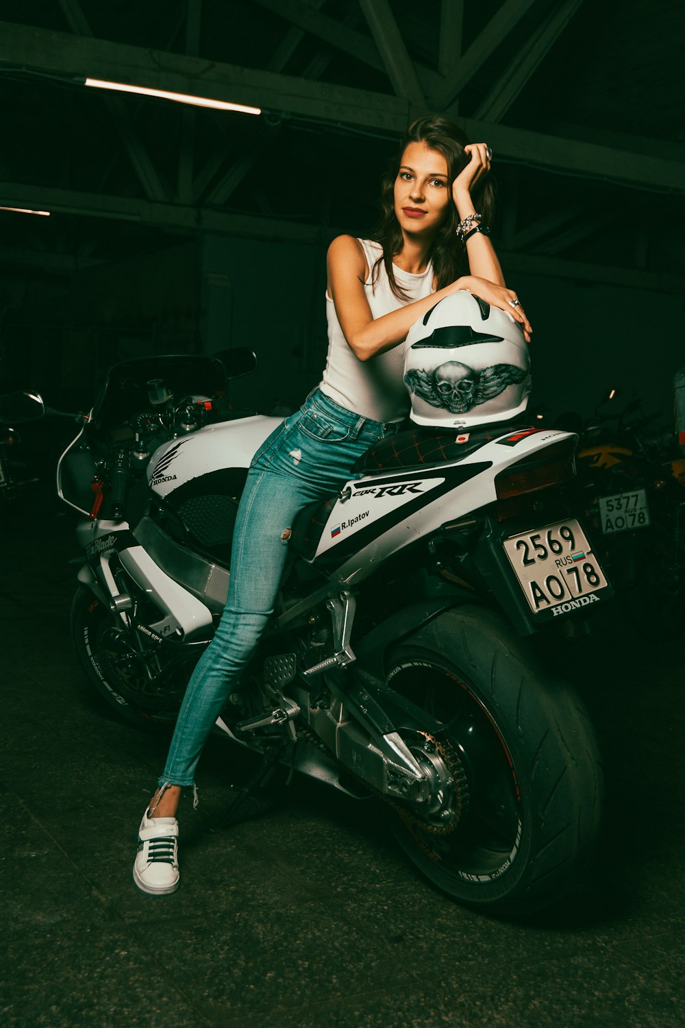 a woman sitting on a motorcycle