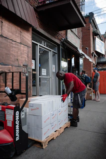 a man loading a box into a truck