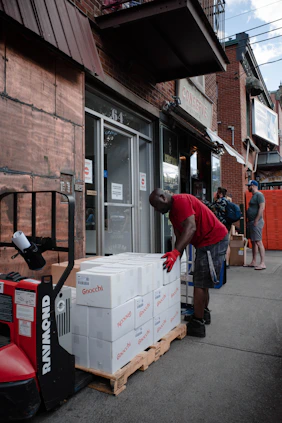 a man loading a box into a truck