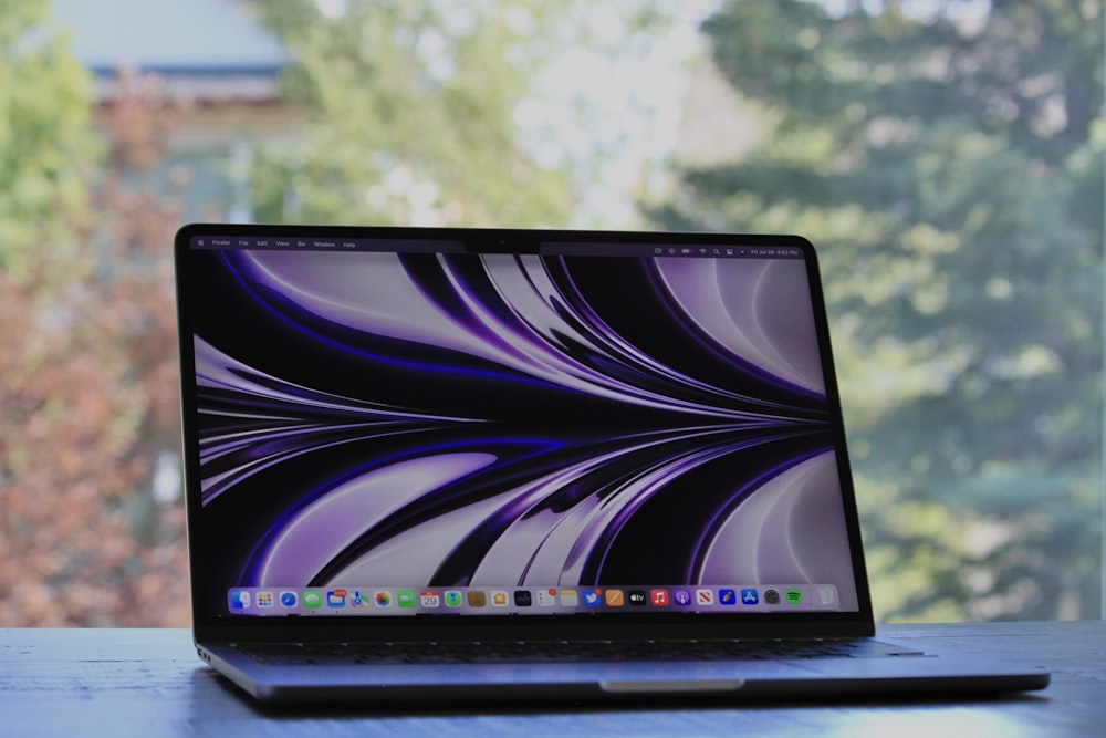 a laptop with a purple screen