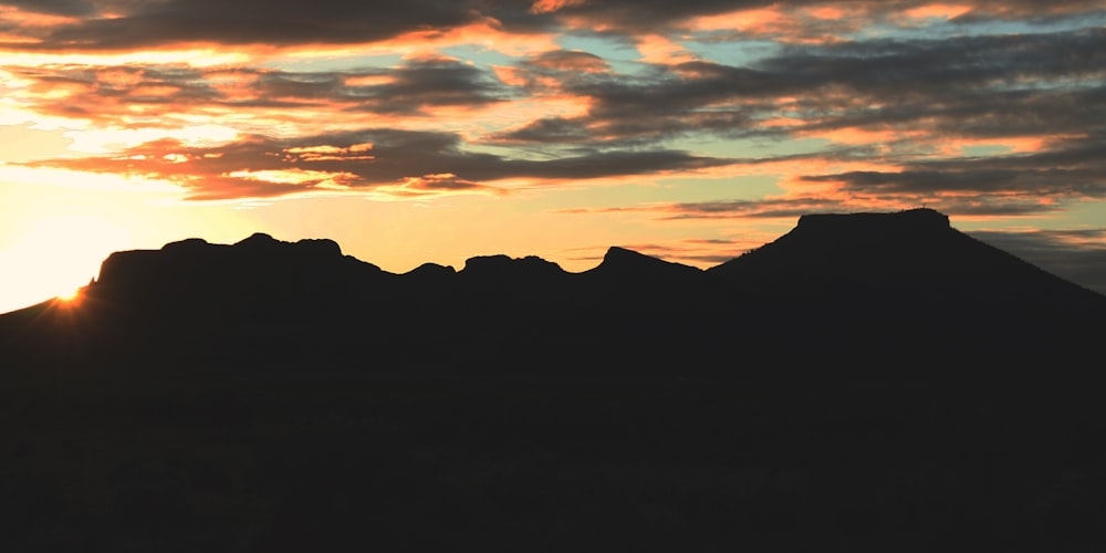 a mountain range with a sunset