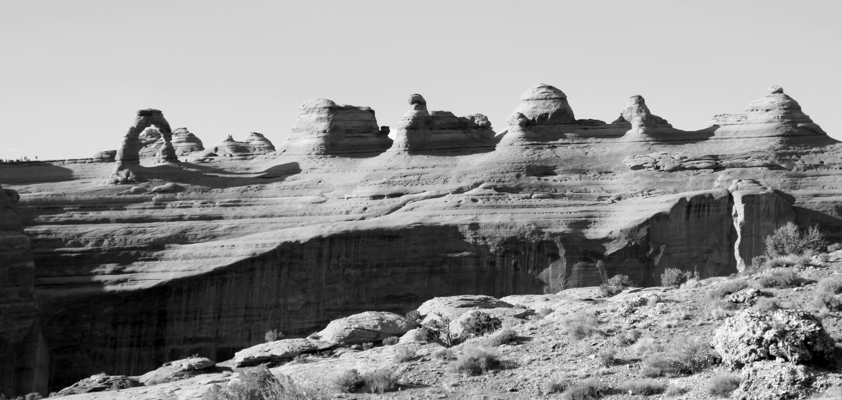 a rocky cliff with snow, 
