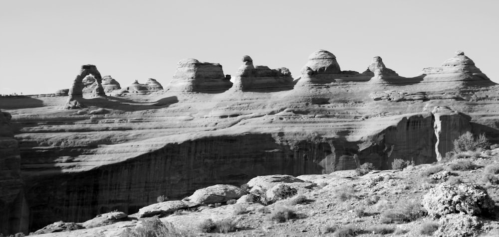 a rocky cliff with snow