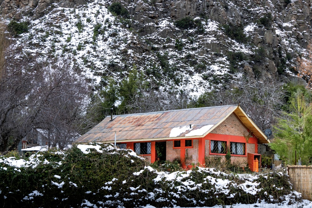 a red house in the snow