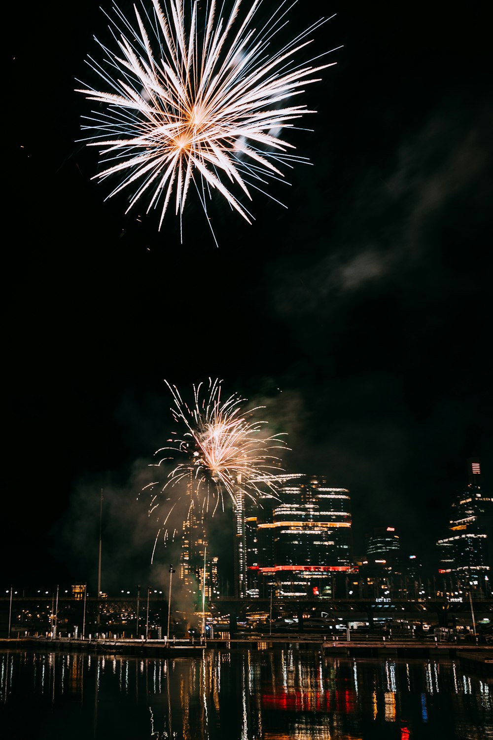 fireworks in the sky over water