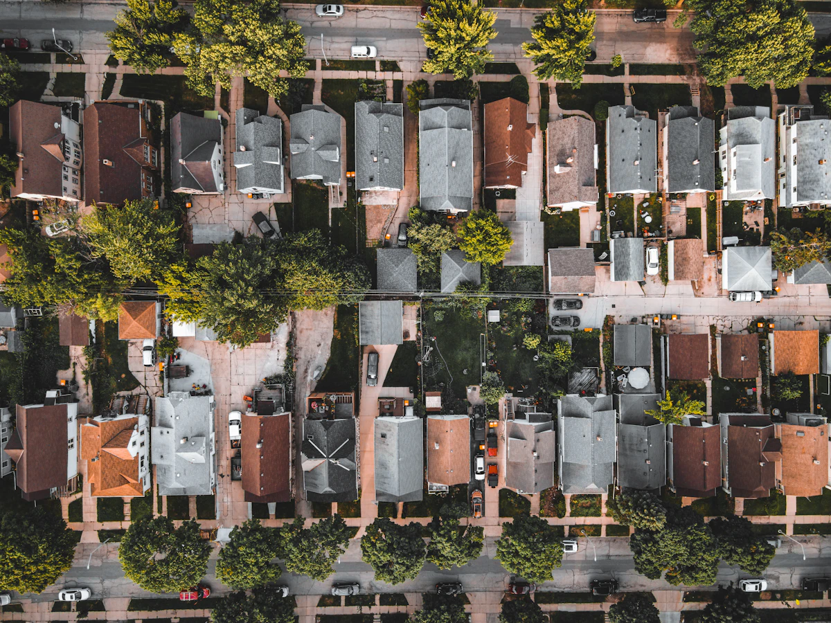 An aerial view of tight rows of older city houses