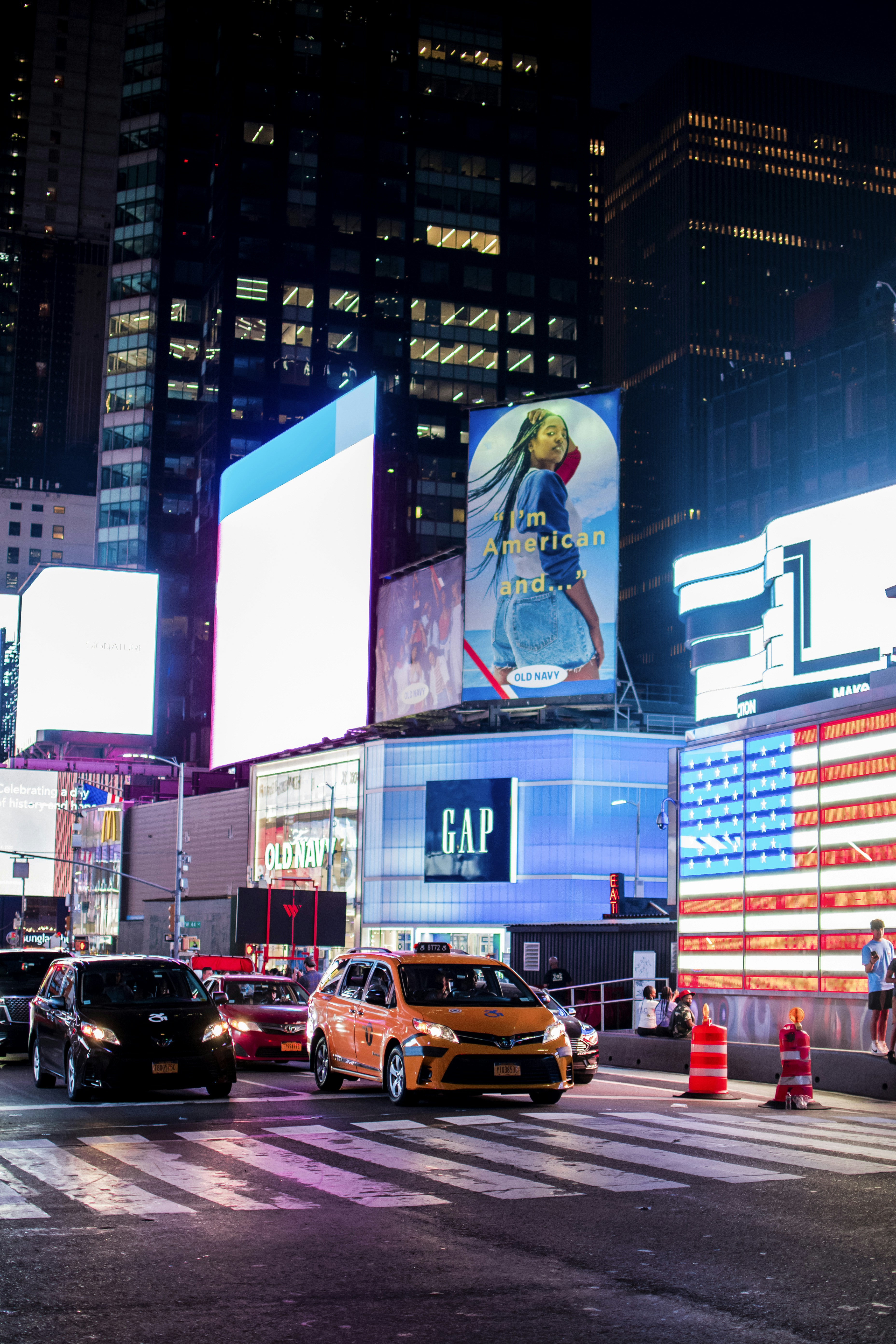 a street with cars and buildings on either side of it