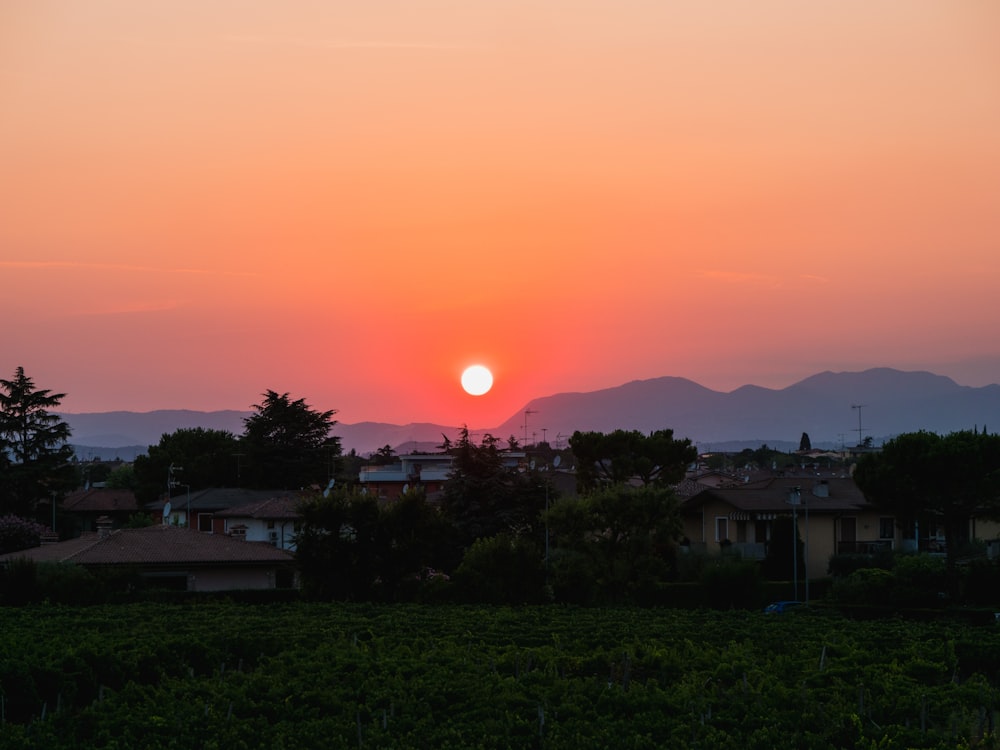 a sunset over a town