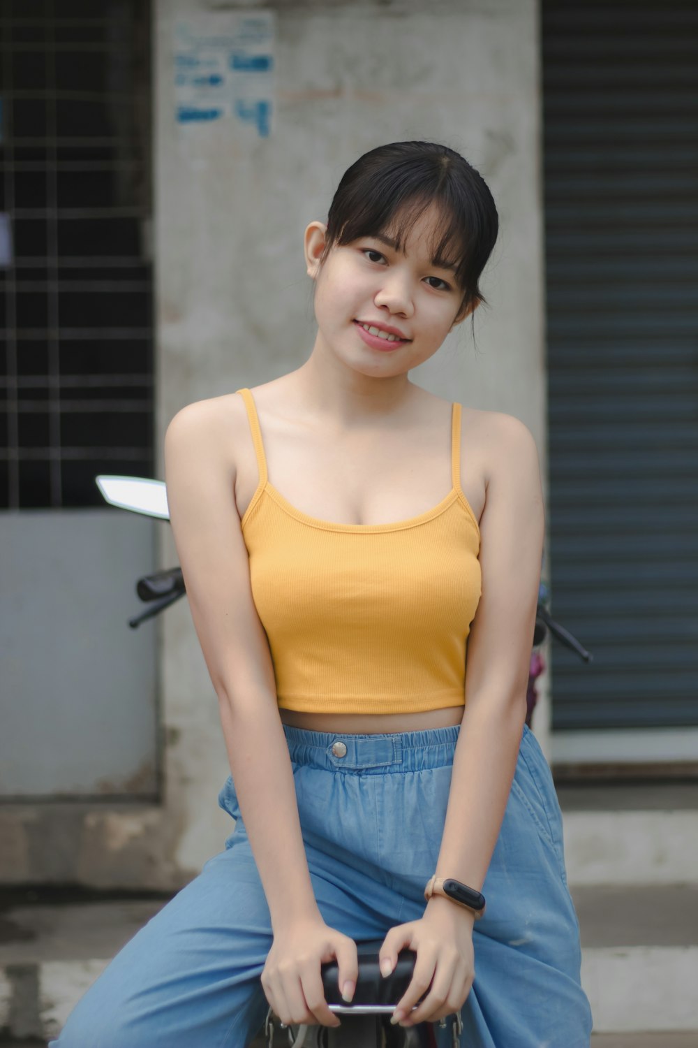 a person in a yellow top