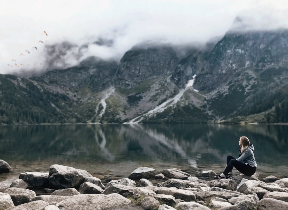 a man standing on a rocky hill