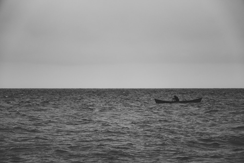 a person in a boat on the water