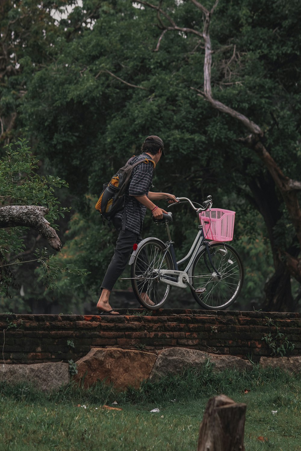 a person walking with a bicycle