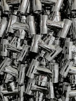 Collection of brass fittings arranged neatly on a wooden surface