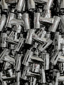 Close-up of grooved pipe fittings arranged neatly on a workshop table