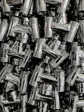 A busy warehouse with neatly stacked pipes and fittings ready for shipment across India.