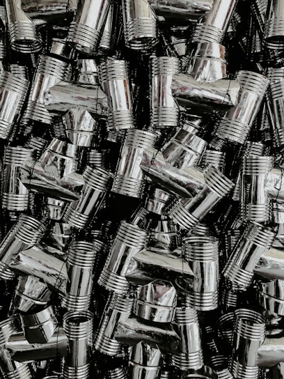 A busy warehouse with neatly stacked pipes and fittings ready for shipment across India.