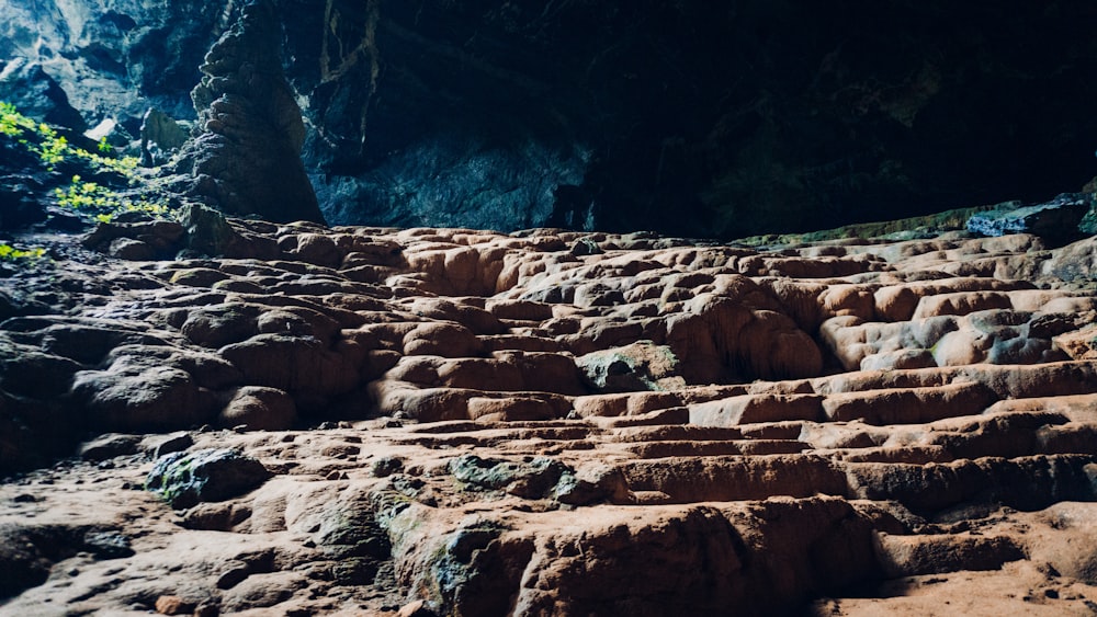 a rocky area with a waterfall