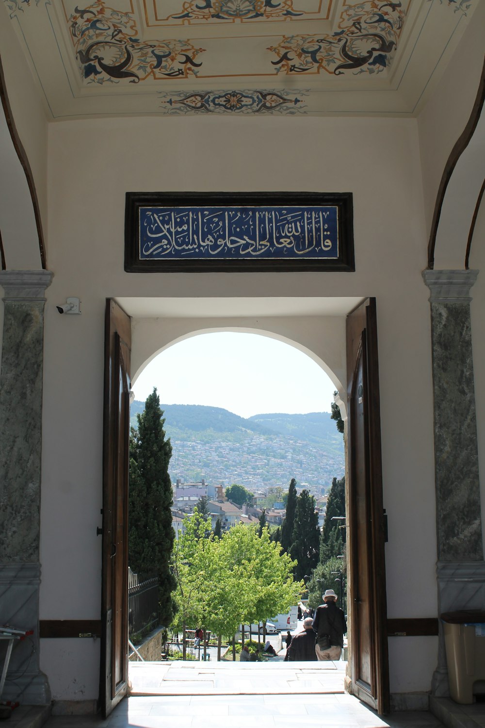 a large archway with a sign above it