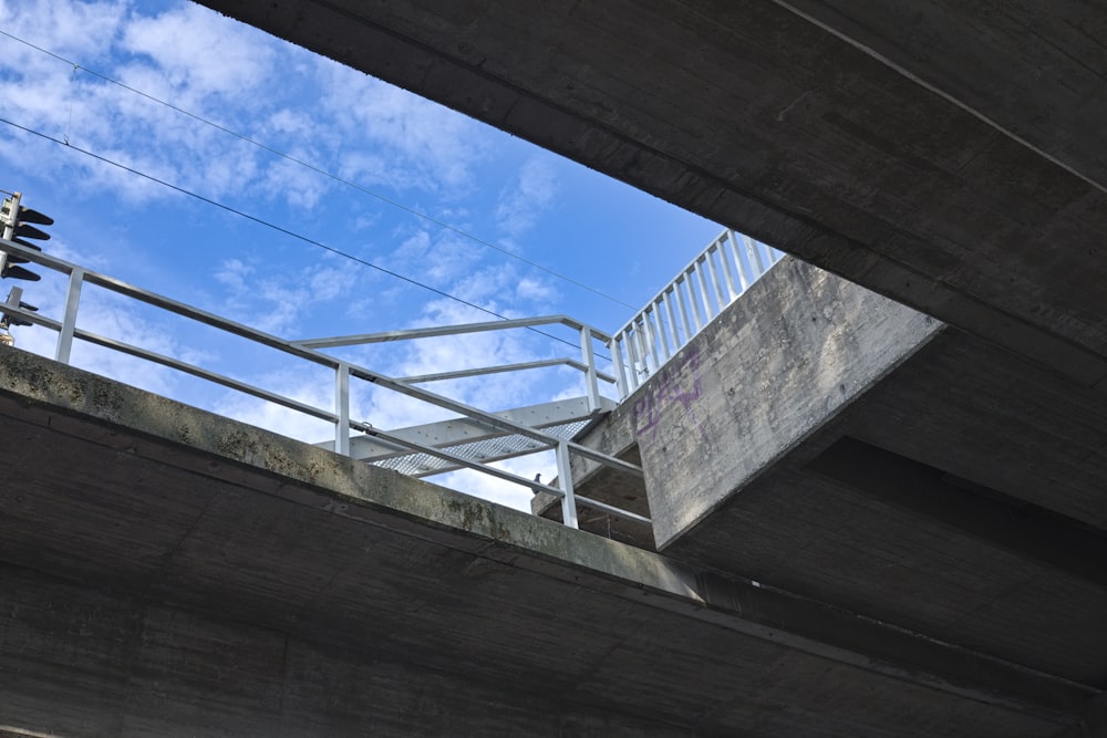a concrete bridge with a railing
