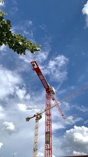 a red crane with a blue sky