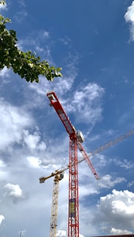 a red crane with a blue sky
