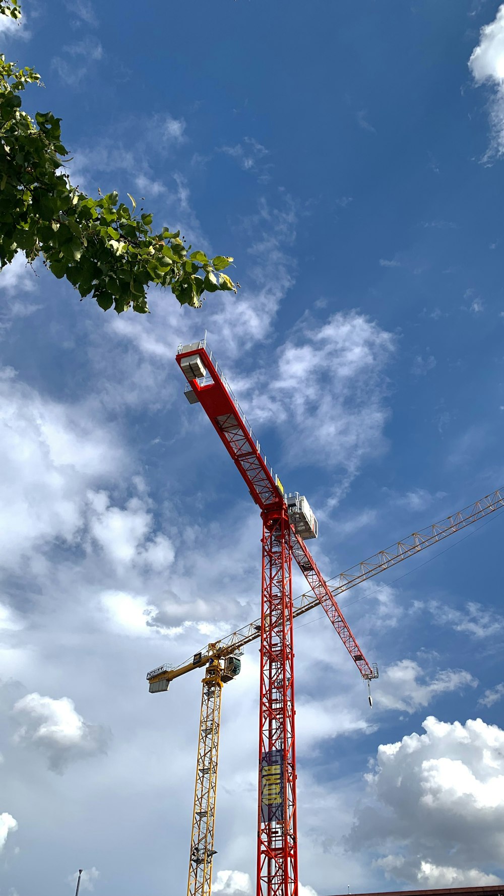 a red crane with a blue sky
