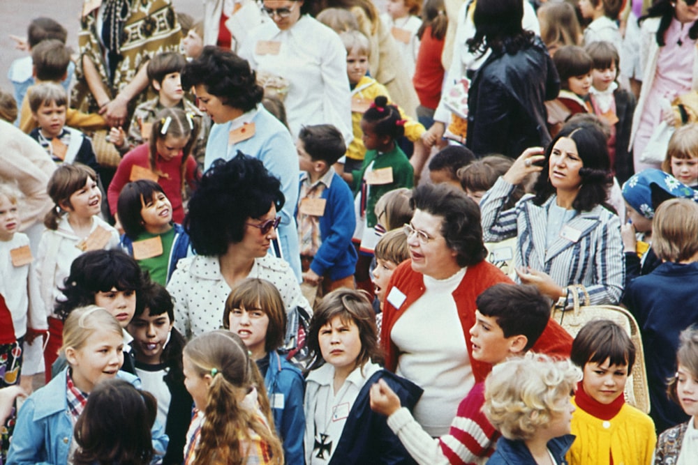 a group of people standing in front of a crowd