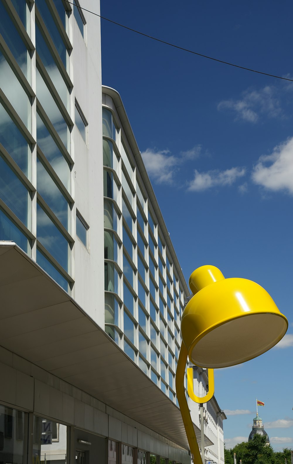 a yellow balloon in front of a building