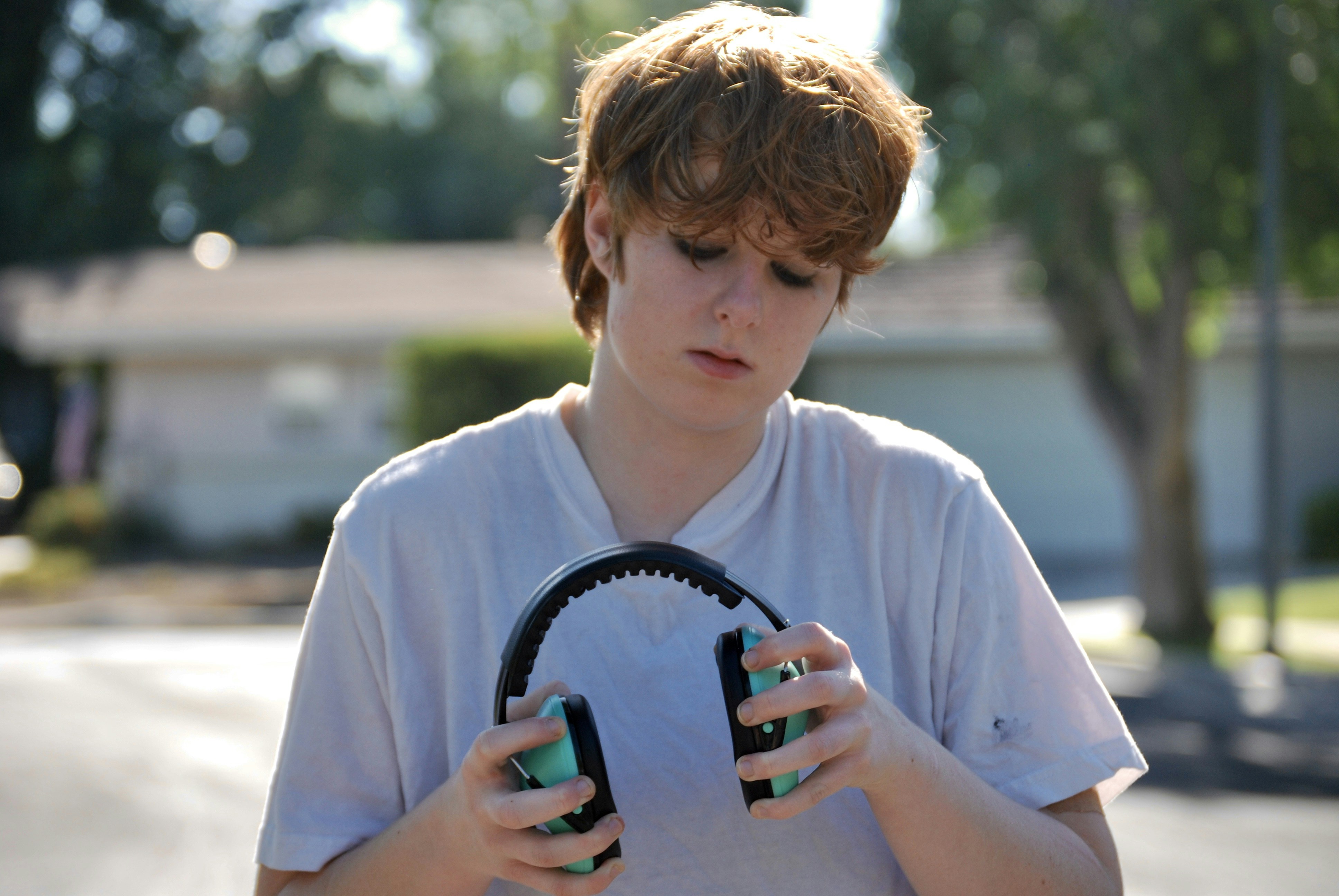 a young man holding a phone