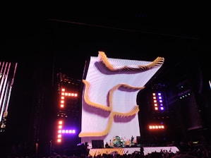 A vibrant LED stage setup glowing with dynamic colors at a live concert.