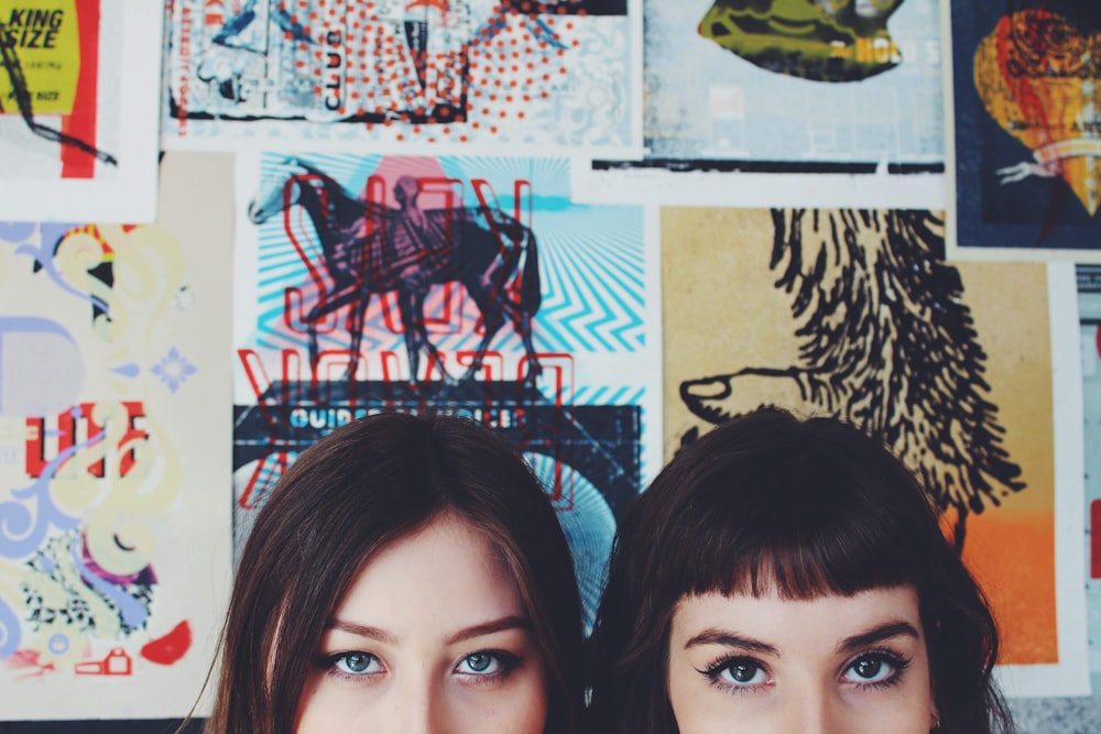 a couple of women posing for the camera