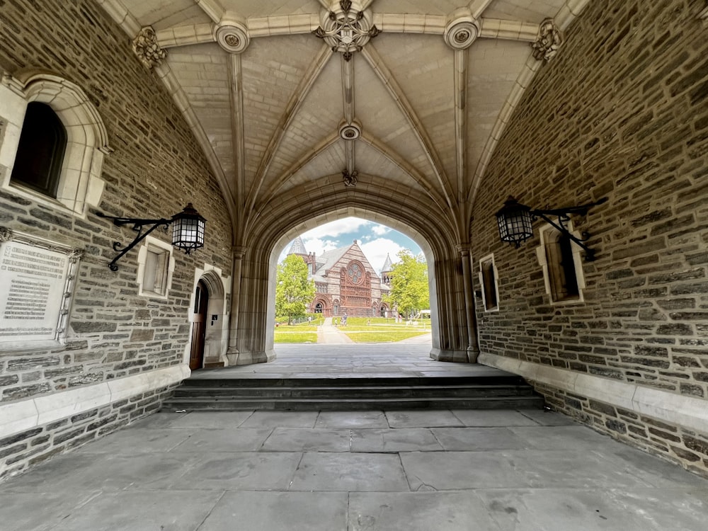 a stone walkway with a stone archway