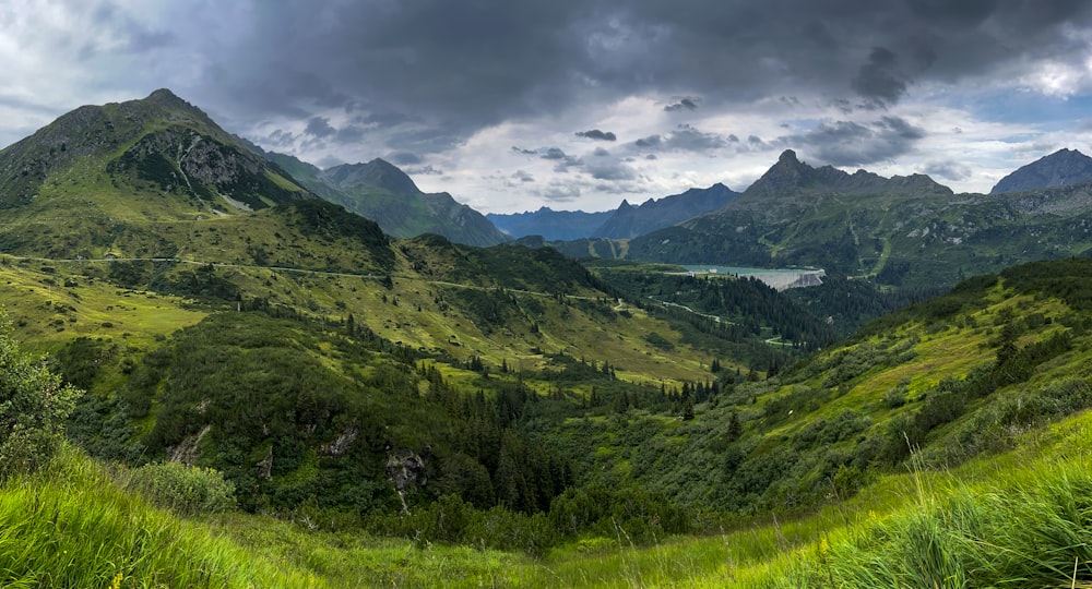 a valley with mountains in the background