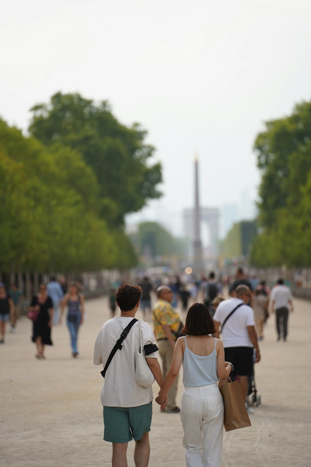 a group of people walking on a street