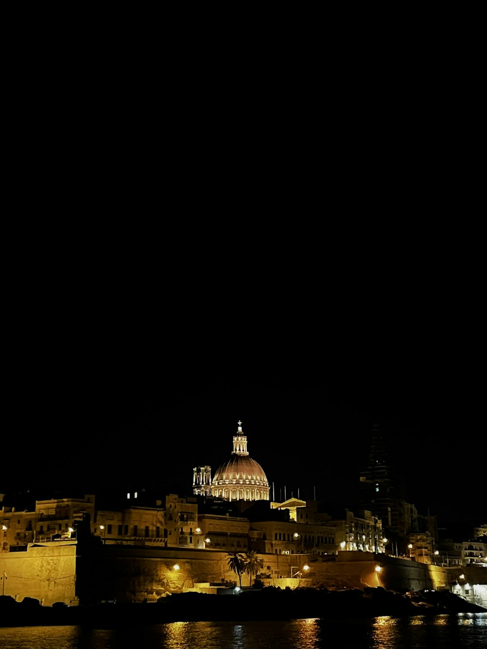 a building with a domed roof at night