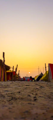 Sunset over a makeshift medical camp with SSF logos visible on tents.