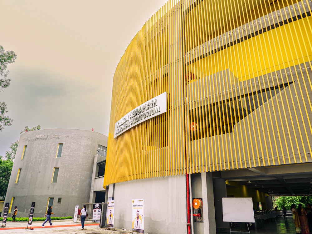 a large yellow building with a sign on it