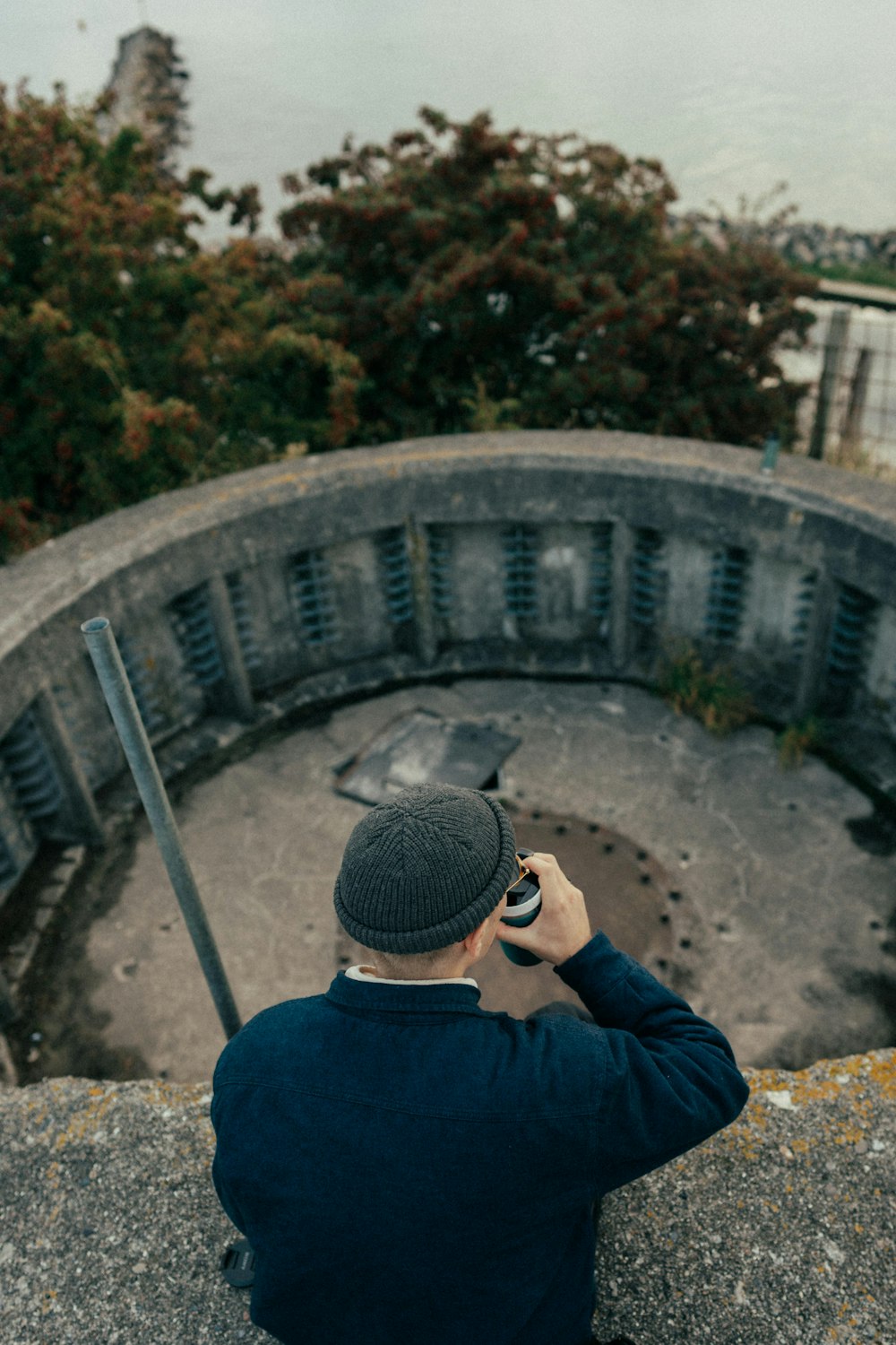 a man taking a picture of a bridge