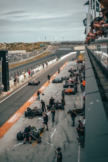 A dynamic image capturing the essence of high-performance teamwork in a Formula 1 pit stop.