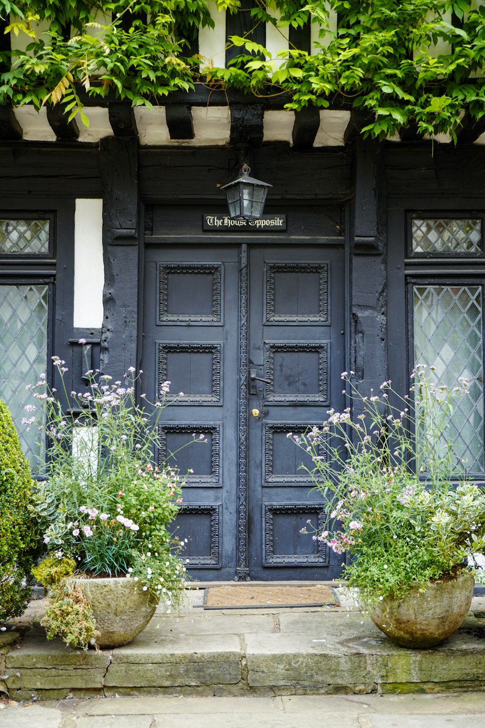 a black door with a light on top