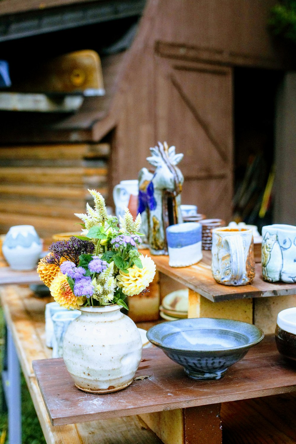 a vase of flowers sits on a table